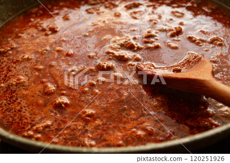 cooking, bolognese sauce, in a frying pan, stirring with a wooden spoon, tomato meat sauce, homemade, no people, cooking, bolognese sauce, in a frying pan, stirring with a wooden spoon, tomato meat sauce, homemade, no people, 120251926
