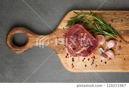 fresh, raw rib eye steak, on a chopping board, top view, no people, 120251967