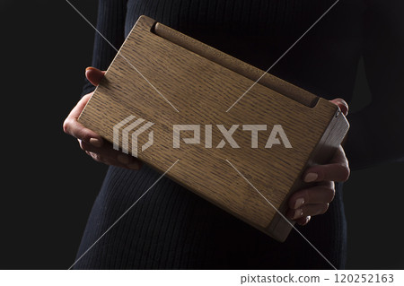 Wooden box in hand 120252163