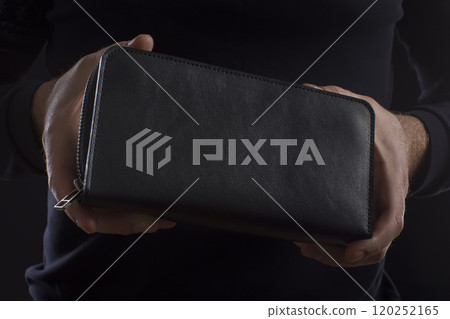 black purse in male hands 120252165