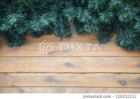 Christmas wooden background decorated with Christmas tree branches 120252212