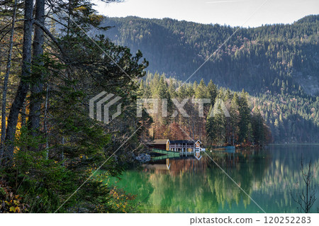 Autumn colors in fall at lake Eibsee, Garmisch-Partenkirchen, Bavarian alps, Germany 120252283