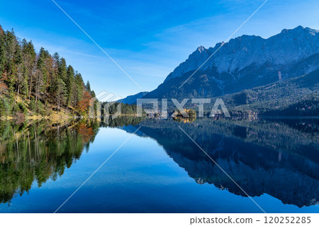 Autumn colors in fall at lake Eibsee, Garmisch-Partenkirchen, Bavarian alps, Germany 120252285