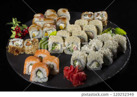 Seth sushi on a black background.Menu of the Japanese restaurant. Several sushi close-ups.A view of the rolls from above. A view of the rolls from above. Traditional Asian Food Seth sushi on a black background.Menu of the Japanese restaurant. Several sushi close-ups.A view of the rolls from above. A view of the rolls from above. Traditional Asian Food 120252349