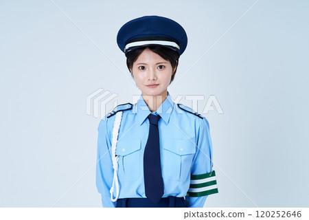 A woman in a security guard or police uniform 120252646