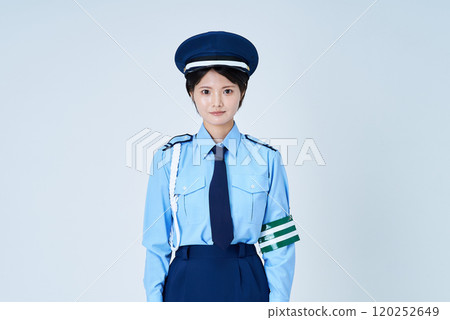 A woman in a security guard or police uniform 120252649
