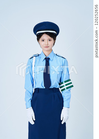 A woman in a security guard or police uniform A woman in a security guard or police uniform 120252656