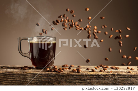 Espresso in glass cup on a old wooden table. Espresso in glass cup on a old wooden table. 120252917