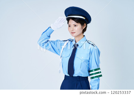 A woman in a security guard uniform saluting 120253337