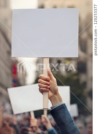 People hands holding banners during a protest parade on city streets. Protesters demonstration with blank pancart for copy space publicity. Multiple activists demand their rights 120253377