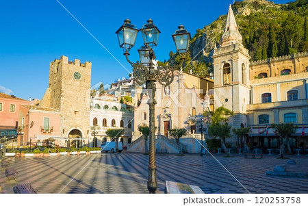 Square Piazza IX Aprile with San Giuseppe church and Clock Tower in Taormina, Sicily, Italy. 120253758
