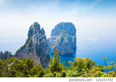 Famous Faraglioni Rocks near Capri Island, Italy. Island of Capri is situated 5 km from mainland in Bay of Naples. 120253782