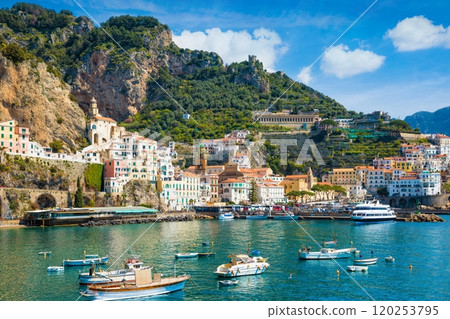 Beautiful Amalfi with hotels on hills leading down to coast, comfortable beaches and azure sea in Campania, Italy. 120253795
