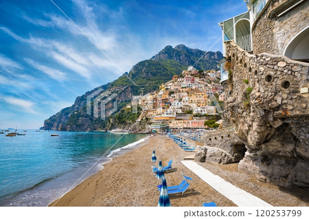 Beautiful Positano with colorful architecture on hills leading down to coast, comfortable beaches and azure sea on Amalfi Coast in Campania, Italy. 120253799