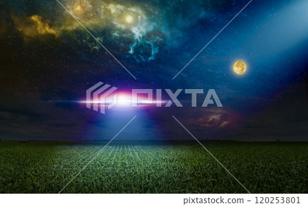 Scenic sci-fi image - ufo inspect green grass field with bright spotlight in dark night sky. Nebula and full moon in starry sky. 120253801
