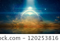 Bright mysterious extraterrestrial lights or UFO shine over glowing horizon. Stars and a powerful searchlight in dark blue sky. Sea is calm below. 120253816