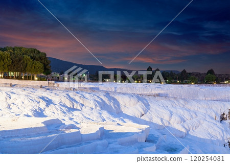 Sunset view of amazing Pamukkale. Travertine terrace formations in Pamukkale, literally "Cotton Castle" in Turkish, most visited attraction in Turkey Sunset view of amazing Pamukkale. Travertine terrace formations in Pamukkale, literally "Cotton Castle" in Turkish, most visited attraction in Turkey 120254081