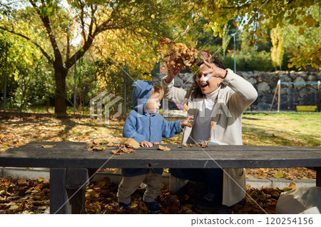 Mother and child enjoying autumn day at the park 120254156