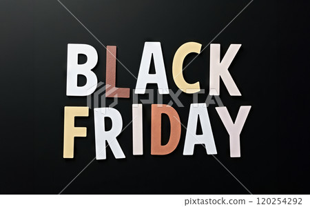 Black Friday words written on a black background. Time for promotions and sales in stores. Black Friday words written on a black background. Time for promotions and sales in stores. 120254292