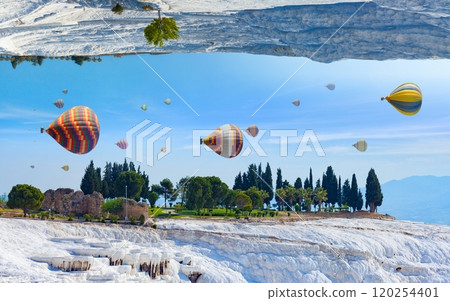 Fantastic unreal world, hot air balloons fly in blue sky between white Pammukale travertines, Turkey Fantastic unreal world, hot air balloons fly in blue sky between white Pammukale travertines, Turkey 120254401