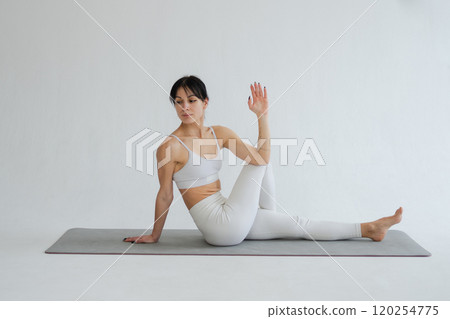 Yoga fitness workout training. Woman practicing yoga isolated on white background. Woman doing sports exercise on yoga mat. Girl in sportswear have training workout for weight loss. Sport and fitness Yoga fitness workout training. Woman practicing yoga isolated on white background. Woman doing sports exercise on yoga mat. Girl in sportswear have training workout for weight loss. Sport and fitness 120254775