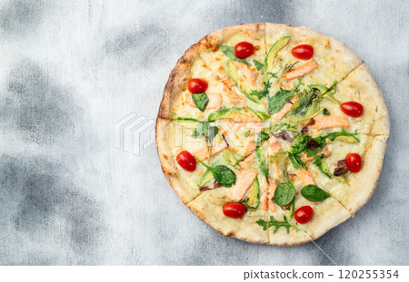Italian pizza with avocado salmon tomatoes and mozzarella photography. top view Italian pizza with avocado salmon tomatoes and mozzarella photography. top view 120255354