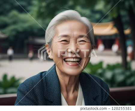 A joyful happy elderly Chinese woman with silver hair beams with delight, reflecting a life filled with experience and happiness. Mongoloid Asian face type. Active pensioner. Generative AI. 120255381