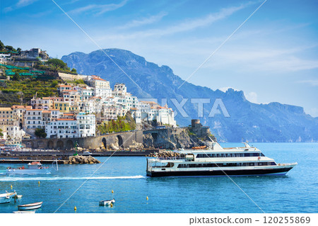 Stunning view of Amalfi, Italy, featuring charming buildings perched on cliffside 120255869