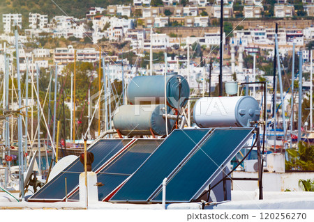 Solar water heaters on urban rooftops 120256270