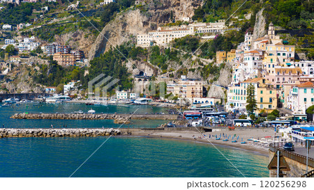 Amalfi on hills leading down to coast, comfortable beach and azure sea in Campania, Italy Amalfi on hills leading down to coast, comfortable beach and azure sea in Campania, Italy 120256298