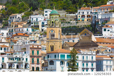 Historic Amalfi Cathedral bell tower amidst italian coastal townscape 120256303