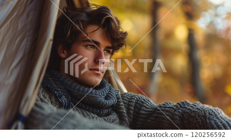 Young guy with wavy hair 120256592