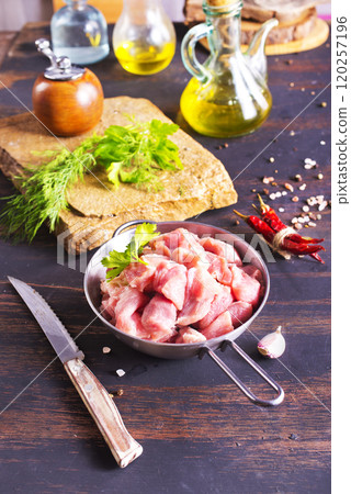 raw meat in metal bowl, meat and herb and spices 120257196