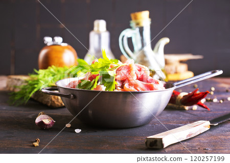 raw meat in metal bowl, meat and herb and spices 120257199