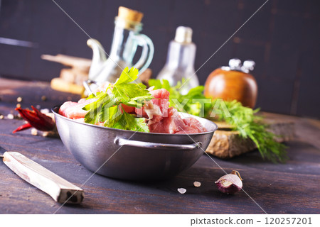 raw meat in metal bowl, meat and herb and spices 120257201