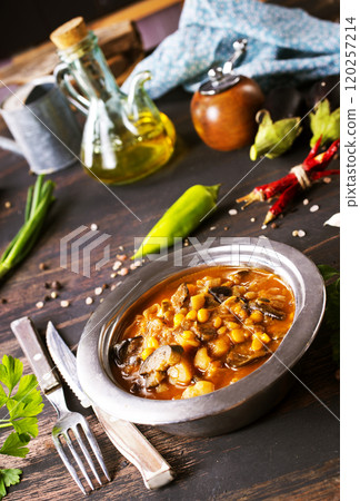 Vegetable stew. in metal bowl. Hot foodstuff. 120257214