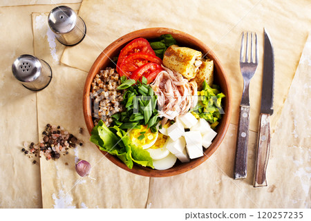 Delicious healthy breakfasts, buckwheat with boiled egg and meat and cheese 120257235