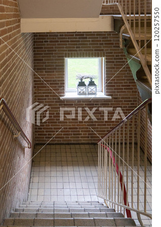 A typical ordinary hallway in Dutch apartment building corridor of a residential building 120257550