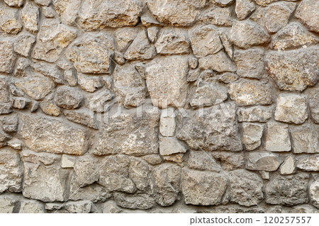 Texture wall stone sandstone with shadows and deep pattern. Clinker tiles or bricks on the wall in the form of wild stone Texture wall stone sandstone with shadows and deep pattern. Clinker tiles or bricks on the wall in the form of wild stone 120257557