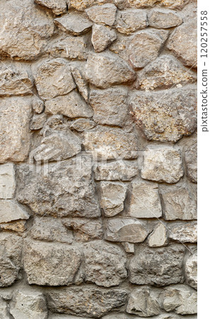 Texture wall stone sandstone with shadows and deep pattern. Vertical shot banner. Clinker tiles or bricks on the wall in the form of wild stone Texture wall stone sandstone with shadows and deep pattern. Vertical shot banner. Clinker tiles or bricks on the wall in the form of wild stone 120257558