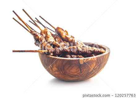 Japanese chicken yakitori in bowl isolated on white background. Japanese chicken yakitori in bowl isolated on white background. 120257763
