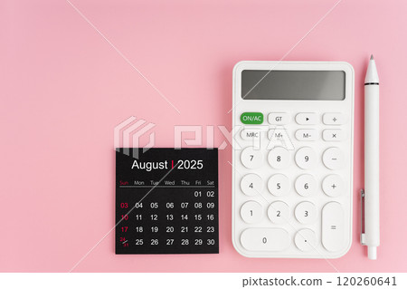 Top view of August 2025 calendar and white calculator with pen on pink background. Top view of August 2025 calendar and white calculator with pen on pink background. 120260641