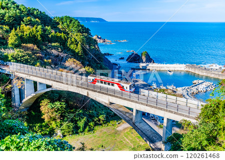 Sanriku Railway A train crossing the Osawa Bridge with the Pacific Ocean in the background 120261468