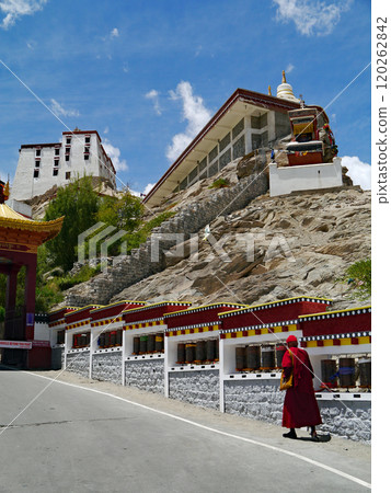 Tibetan monks walking along the approach to Thiksey Gompa in the western part of Ladakh, known as Little Tibet in northern India. 120262842