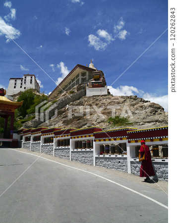 Tibetan monks walking along the approach to Thiksey Gompa in the western part of Ladakh, known as Little Tibet in northern India. Tibetan monks walking along the approach to Thiksey Gompa in the western part of Ladakh, known as Little Tibet in northern India. 120262843