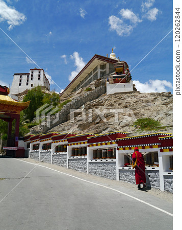 Tibetan monks walking along the approach to Thiksey Gompa in the western part of Ladakh, known as Little Tibet in northern India. 120262844
