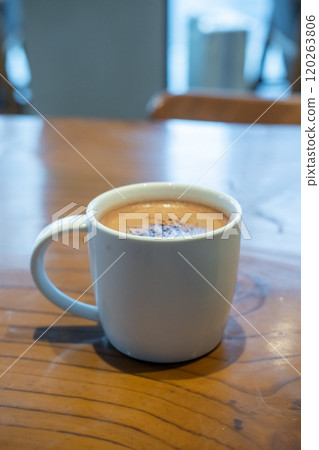 A cup of hot chocolate on the table in the cafe A cup of hot chocolate on the table in the cafe 120263806