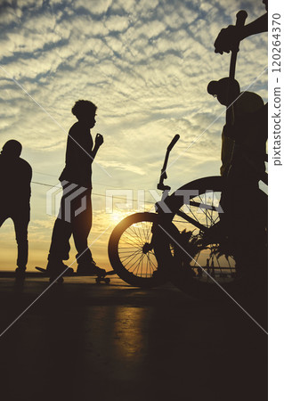 Skateboarding and BMX bike Silhouette Extreme Skatepark Images Orange Sunlight Youth Culture Enjoy Sports Vacation Skateboard Skateboarding and BMX bike Silhouette Extreme Skatepark Images Orange Sunlight Youth Culture Enjoy Sports Vacation Skateboard 120264370