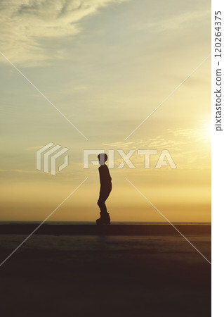 Silhouette young in rollerblading, summer sunset background. Culture Enjoy Sports Vacation 120264375