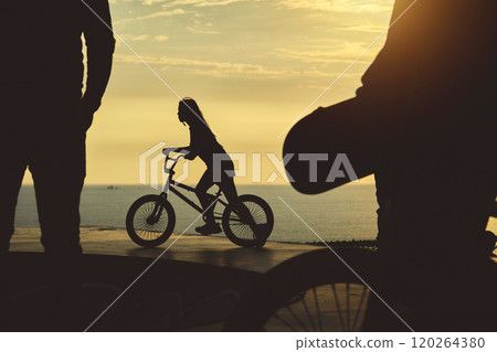 Skateboarding and BMX bike Silhouette Extreme Skatepark Images Orange Sunlight Youth Culture Enjoy Sports Vacation Skateboard Skateboarding and BMX bike Silhouette Extreme Skatepark Images Orange Sunlight Youth Culture Enjoy Sports Vacation Skateboard 120264380